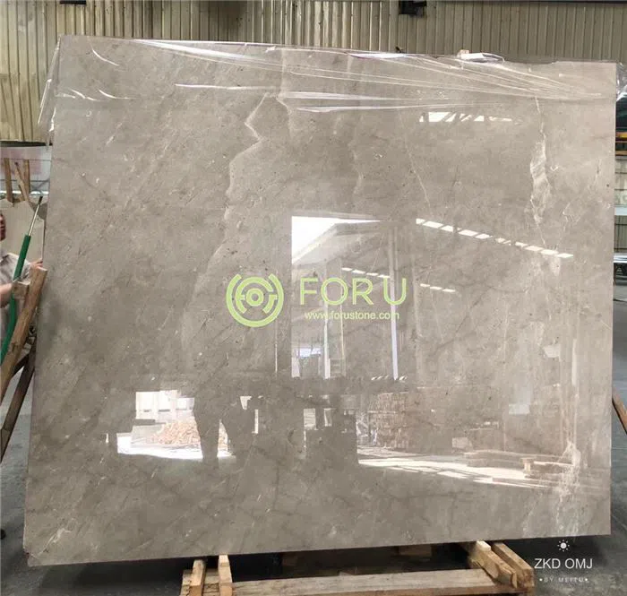 Custom cut-to-size Castle Grey marble floor tiles undergoing dry-lay inspection at the factory to ensure color consistency and vein matching.
