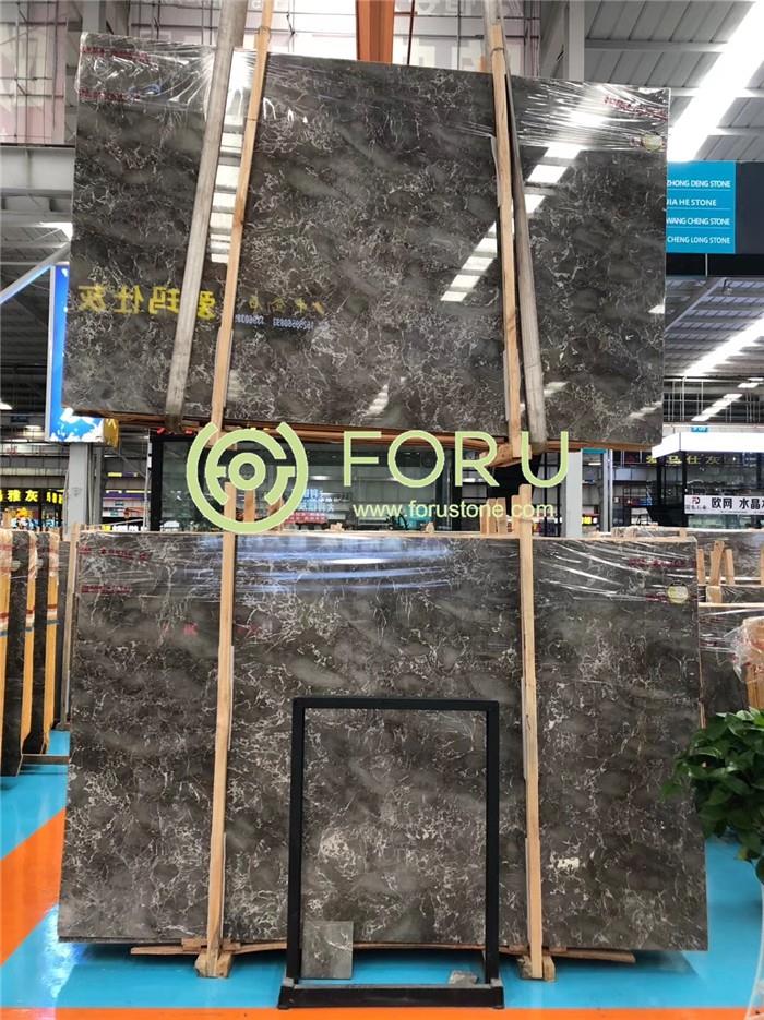 Close-up texture of Cary Ice Grey marble highlighting dense surface and sharp white ice-like veins