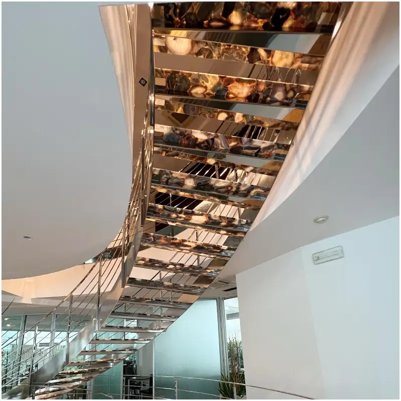 Grey Agate gemstone backlit stair feature installed in a luxury villa interior