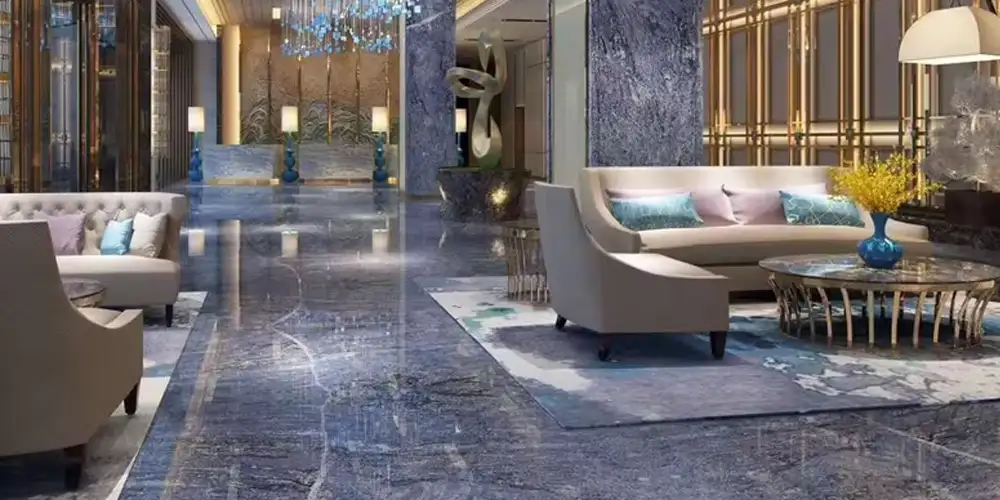 As 10 principais aplicações de luxo do granito Azul Bahia: Tendências de design para casas e espaços comerciais em 2026 6 Azul-Bahia-Blue-Granite-Luxury-Hotel-Lobby-Projectos