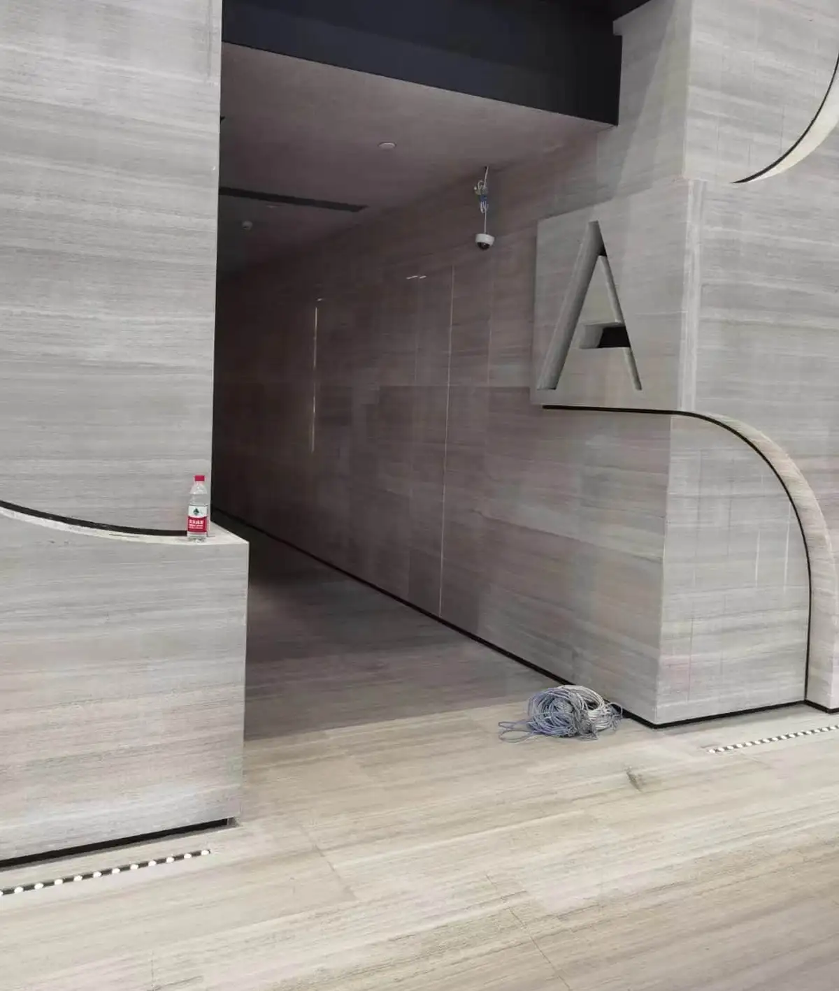 Silk Serpeggiante Marble Curved Sculptural Wall with Embossed Letter A Signage for Modern Office Building Zone A Entrance Corridor