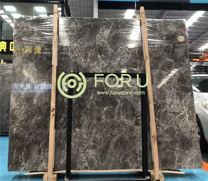 Polished Cary Ice Grey marble slab showing dark grey background with dynamic white veining